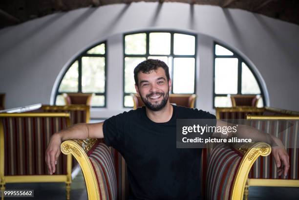 Alexander Skornia, director of "1 Stralau", sits on a golden chair in the top floor of the club bordering the River Spree in Berlin, Germany, 30...