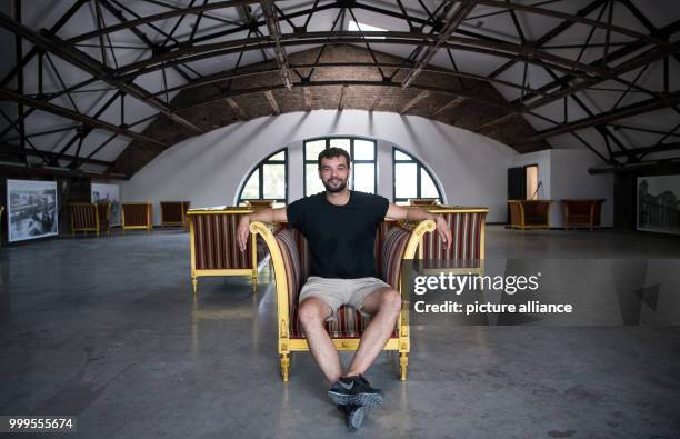 Alexander Skornia, director of "1 Stralau", sits on a golden chair in the top floor of the club bordering the River Spree in Berlin, Germany, 30...