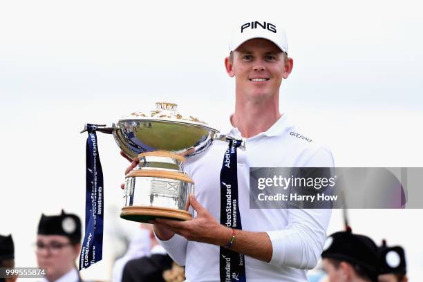 Brandon Stone of South Africa celebrates victory with the trophy during day four of the Aberdeen Standard Investments Scottish Open at Gullane Golf...