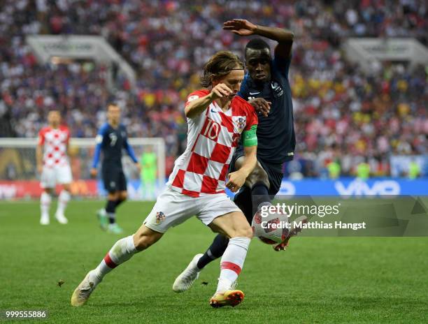 Luka Modric of Croatia and Blaise Matuidi of France compete for the ball during the 2018 FIFA World Cup Final between France and Croatia at Luzhniki...