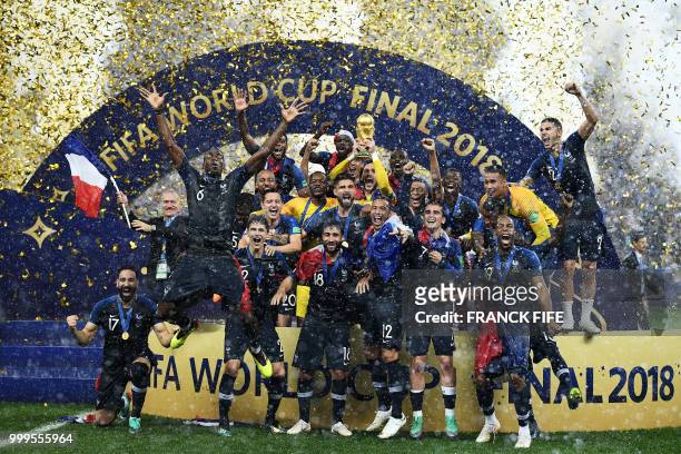 France's players celebrate as they hold their World Cup trophy during the trophy ceremony at the end of the Russia 2018 World Cup final football...
