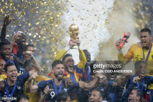 France's players celebrate with the World Cup trophy after the Russia 2018 World Cup final football match between France and Croatia at the Luzhniki...