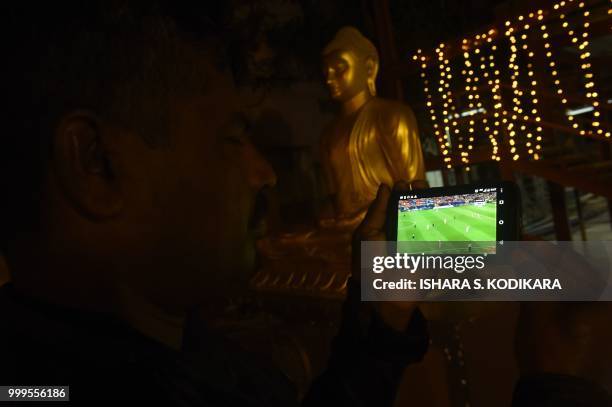 Sri Lankan football fans watching FIFA 2018 World Cup final match between France and Croatia in Colombo on July 15, 2018. - Sri Lanka did not...