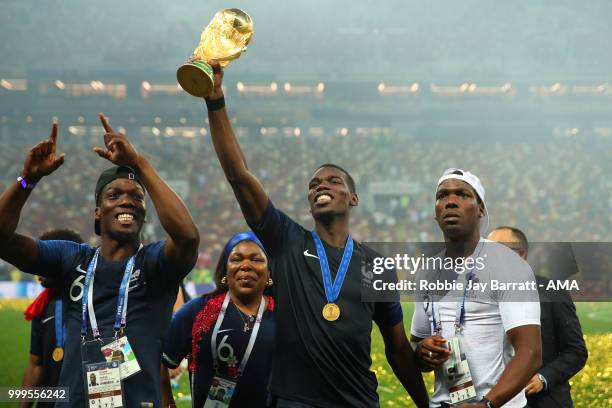 Paul Pogba of France celebrates victory with mother Yeo and brothers Mathias and Florentin at the end of of the 2018 FIFA World Cup Russia Final...