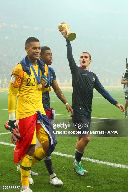 Antoine Griezmann of Franceand Alphonse Areola of France celebrate with the trophy at the end of of the 2018 FIFA World Cup Russia Final between...