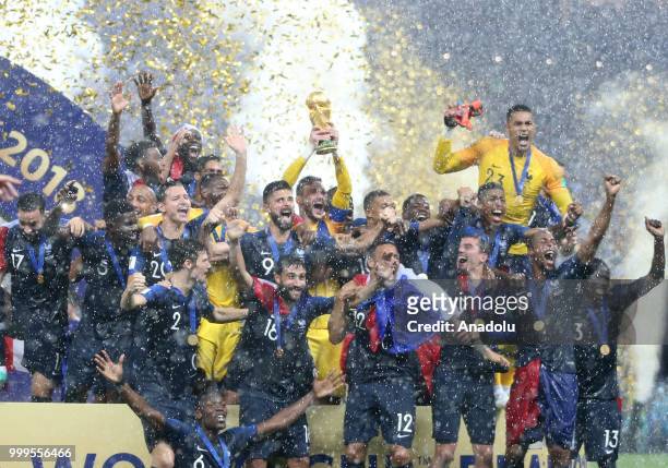 French players hold up the trophy as they celebrate FIFA World Cup championship after the 2018 FIFA World Cup Russia final match between France and...