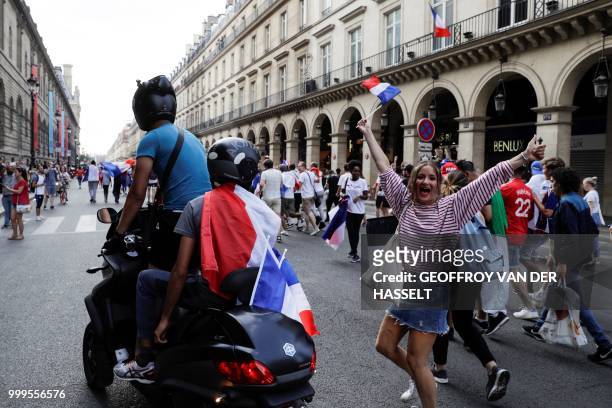 France supporters celebrate after France won the Russia 2018 World Cup final football match between France and Croatia, Rue de Rivoli in Paris on...