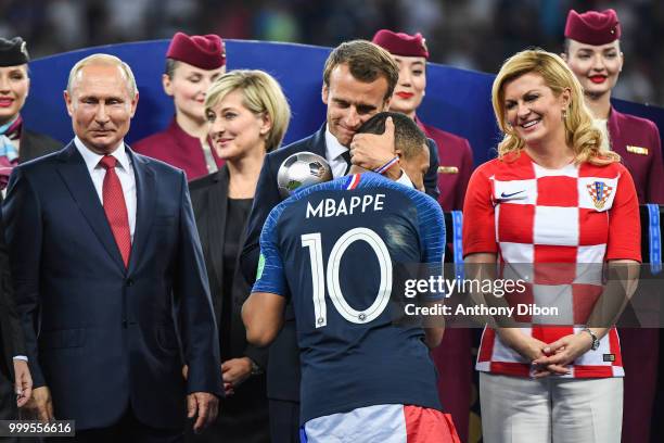 Russia's President Vladimir Putin, France's President Emmanuel Macron, Kylian Mbappe of France and Croatia's President Kolinda Grabar Kitarovic...