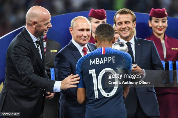 President Gianni Infantino, Russia's President Vladimir Putin, Kylian Mbappe of France and France's President Emmanuel Macron during the World Cup...