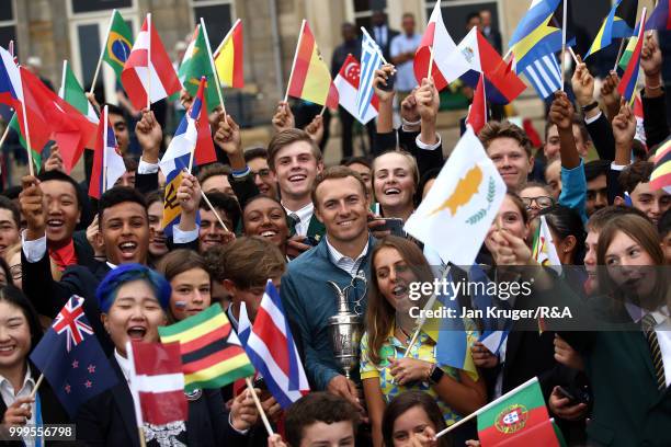 Open Champion Jordan Spieth of United States of America poses with junior players during the Junior Open Championship opening ceremony at The Old...