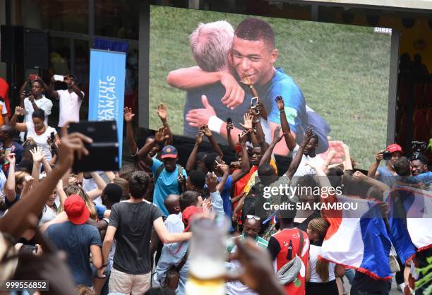 Supporters celebrate France's victory at the end of the Russia 2018 World Cup final football match between France and Croatia, on July 15, 2018 at...