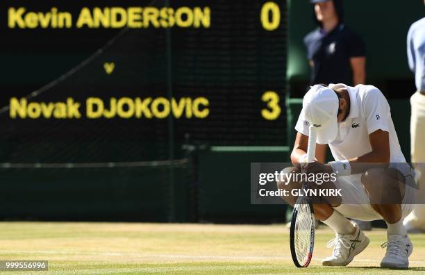 Serbia's Novak Djokovic celebrates after beating South Africa's Kevin Anderson 6-2, 6-2, 7-6 in their men's singles final match on the thirteenth day...