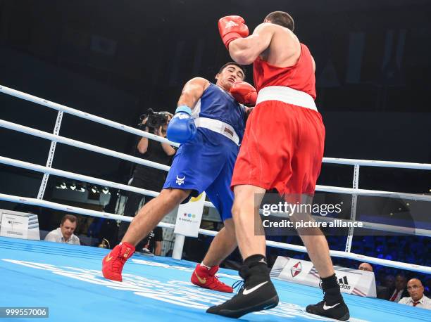 The Russian boxer Evgeny Tishchenko fights against the Uzbek boxer Sanjar Tursunov in the heavy weight class during the Ameteur's Boxing World...