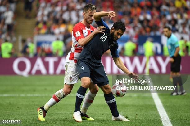 Croatia's midfielder Ivan Rakitic vies with France's midfielder Nabil Fekir during the Russia 2018 World Cup final football match between France and...