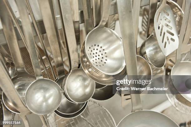 ladles, slotted spoon, kitchen tools in an industrial kitchen, germany - werner stock pictures, royalty-free photos & images