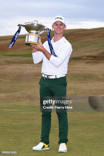 Brandon Stone of South Africa celebrates victory with the trophy during day four of the Aberdeen Standard Investments Scottish Open at Gullane Golf...