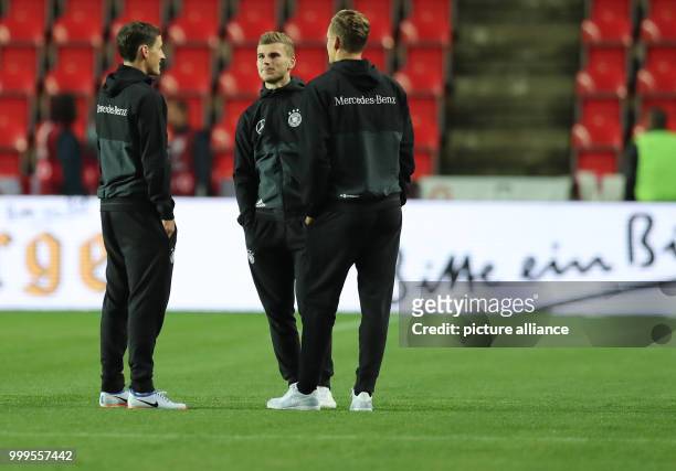 The German players Sebastian Rudy , Timo Werner and goalkeeper Marc-Andre ter Stegen are talking before the soccer World Cup qualification group...