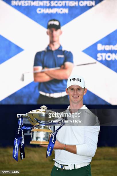 Brandon Stone of South Africa celebrates victory with the trophy during day four of the Aberdeen Standard Investments Scottish Open at Gullane Golf...