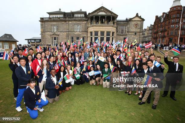 Open Champion Jordan Spieth of United States of America poses with junior players during the Junior Open Championship opening ceremony at The Old...
