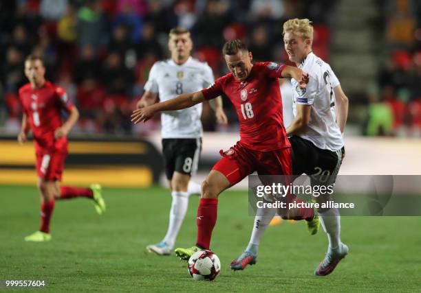 Germany's Julian Brandt and Czech Republic's Vladimir Darida vie for the ball during the soccer World Cup qualification group stage match between the...