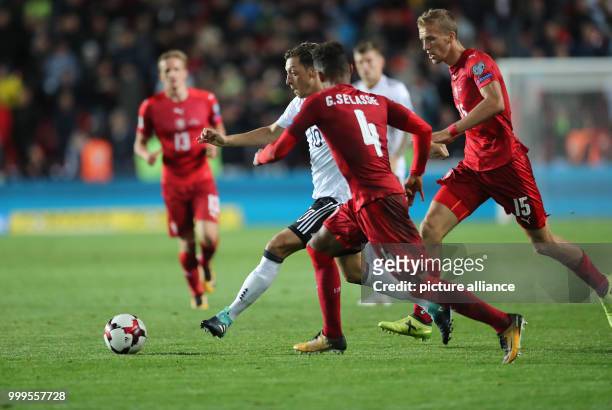 Germany's Mesut Oezil and Czech Republic's Theodor Gebre Selassie vie for the ball during the soccer World Cup qualification group stage match...