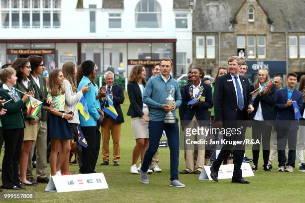 Open Champion Jordan Spieth of United States of America arrives with the Claret Jug during the Junior Open Championship opening ceremony at The Old...