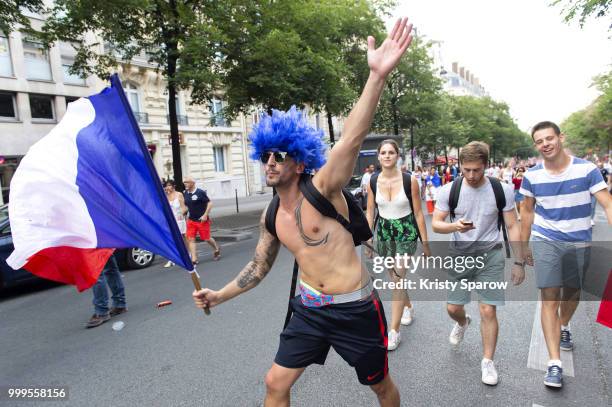 French fans gather at the Arc de Triomphe to celebrate the France's victory over Croatia in the 2018 FIFA World Cup final on July 15, 2018 in Paris,...