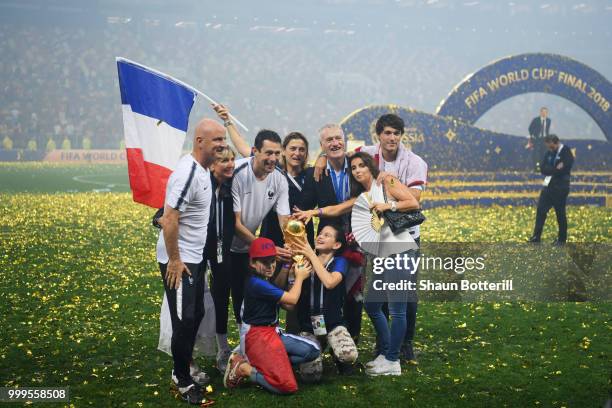 Didier Deschamps, Manager of France celebrates victory with family and staff following the 2018 FIFA World Cup Final between France and Croatia at...