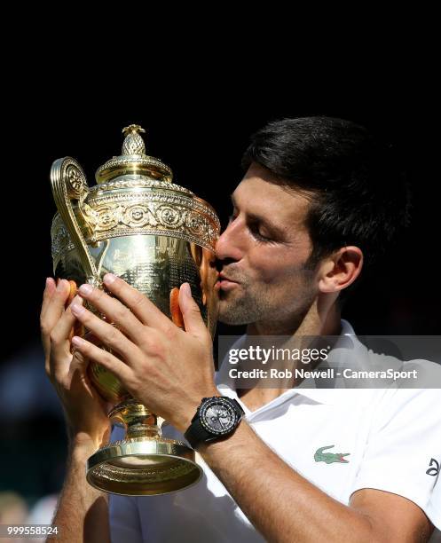 Novak Djokovic with the trophy after winning his match against Kevin Anderson in the Final of the Gentlemen's Singles at All England Lawn Tennis and...