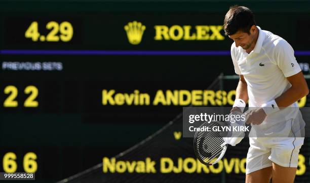 Serbia's Novak Djokovic celebrates after beating South Africa's Kevin Anderson 6-2, 6-2, 7-6 in their men's singles final match on the thirteenth day...