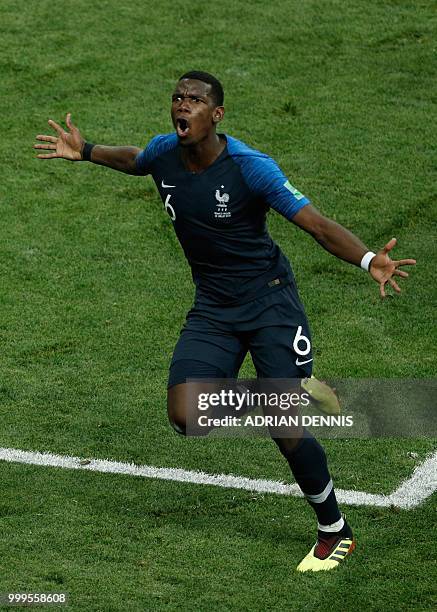 France's midfielder Paul Pogba celebrates after scoring a goal during the Russia 2018 World Cup final football match between France and Croatia at...