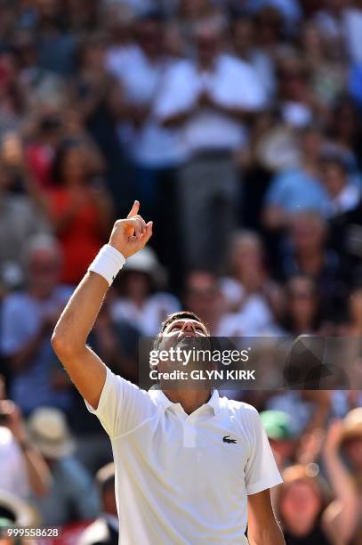 Serbia's Novak Djokovic celebrates after beating South Africa's Kevin Anderson 6-2, 6-2, 7-6 in their men's singles final match on the thirteenth day...
