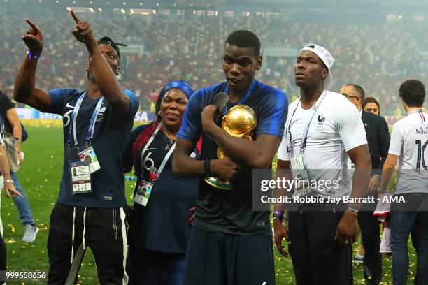 Paul Pogba of France celebrates victory with mother Yeo and brothers Mathias and Florentin at the end of of the 2018 FIFA World Cup Russia Final...