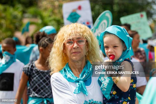 Woman and a girl take part in a march for the decriminalization of abortion in three circumstances -when the life of the pregnant woman is in danger,...