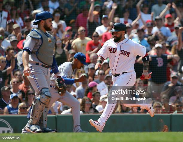 Sandy Leon of the Boston Red Sox scores in the fifth inning on a sac fly hit by Mookie Betts of the Boston Red Sox against the Toronto Blue Jays in...