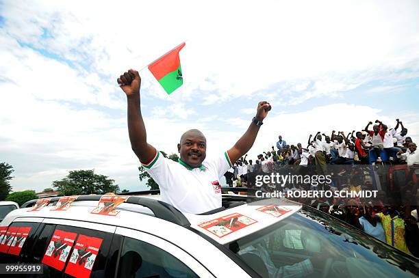 Burundi enters high-stakes election marathon** Burundian President Pierre Nkurunziza waves to supporters near the town of Rugombo in northern Burundi...