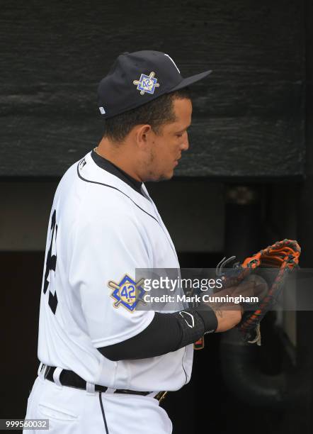 Miguel Cabrera of the Detroit Tigers looks on from the dugout while wearing the special number 42 commemorative patches to celebrate Jackie Robinson...