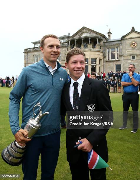 Open Champion Jordan Spieth of United States of America poses with junior players during the Junior Open Championship opening ceremony at The Old...