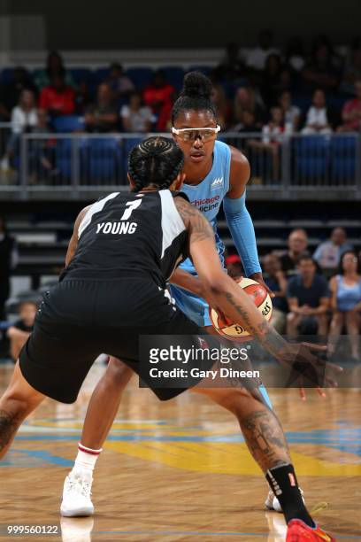 Diamond DeShields of the Chicago Sky handles the ball against Tamera Young of the Las Vegas Aces on July 10, 2018 at the Wintrust Arena in Chicago,...