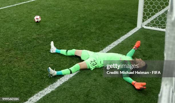 Goalkeeper Danijel Subasic of Croatia lies dejected following the third goal for France scored by Paul Pogba during the 2018 FIFA World Cup Final...