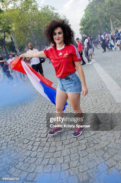 French fans gather on the Arc de Triomphe to celebrate the victory of France over Croatia 4-2 during the World Cup on July 15, 2018 in Paris, France.