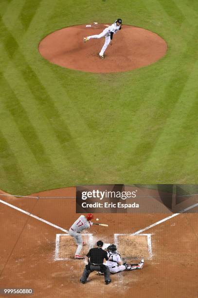 Jose Urena of the Miami Marlins throws a pitch to Rhys Hoskins of the Philadelphia Phillies during the third inning of the game at Marlins Park on...