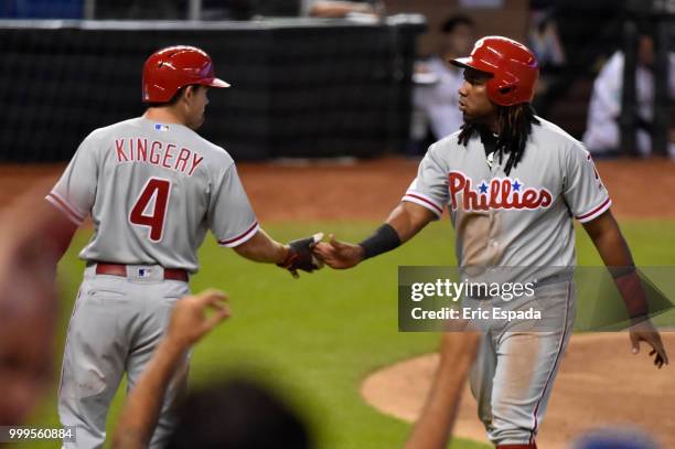 Scott Kingery of the Philadelphia Phillies congratulates Maikel Franco after scoring on a Cesar Hernandez triple during the fourth inning against the...