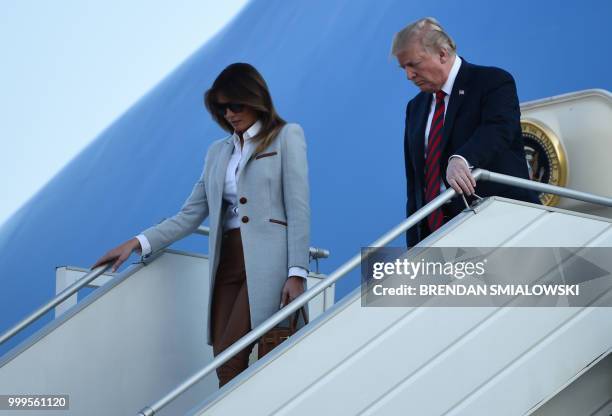 President Donald Trump and First Lady Melania Trump disembark from Air Force One upon arrival at Helsinki-Vantaa Airport in Helsinki, on July 15,...