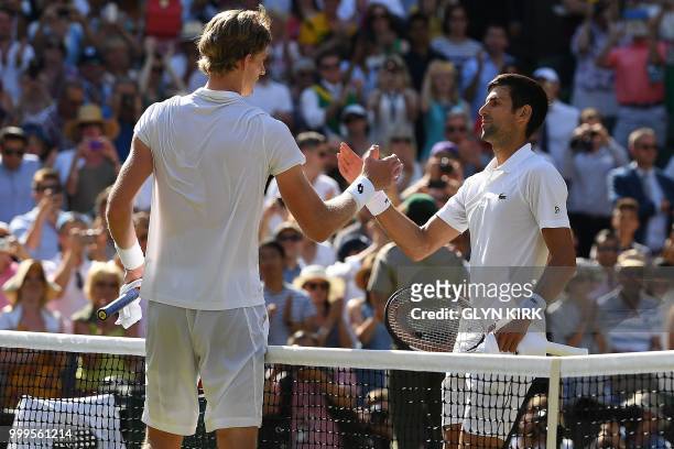 Serbia's Novak Djokovic greets South Africa's Kevin Anderson after winning 6-2, 6-2, 7-6 in their men's singles final match on the thirteenth day of...