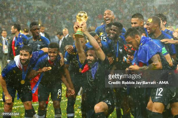 Adil Rami of France and his team-mates celebrate victory with the FIFA World Cup trophy at the end of of the 2018 FIFA World Cup Russia Final between...