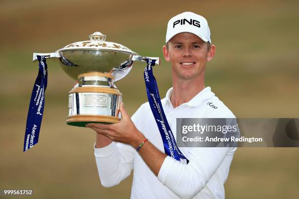 Brandon Stone of South Africa celebrates victory with the trophy during day four of the Aberdeen Standard Investments Scottish Open at Gullane Golf...