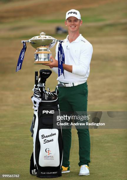 Brandon Stone of South Africa celebrates victory with the trophy during day four of the Aberdeen Standard Investments Scottish Open at Gullane Golf...