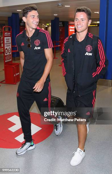 Matteo Darmian and Ander Herrera of Manchester United depart for the club's pre-season tour of the USA at Manchester Airport on July 15, 2018 in...