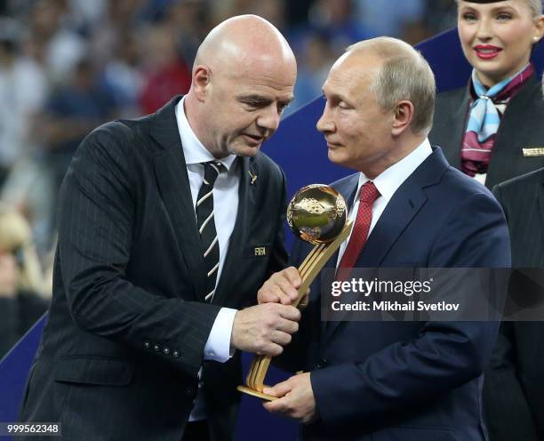 President Gianni Infantino and Russian President Vladimir Putin attend the 2018 FIFA World Cup final awarding ceremony at Luzhniki Stadium on July...